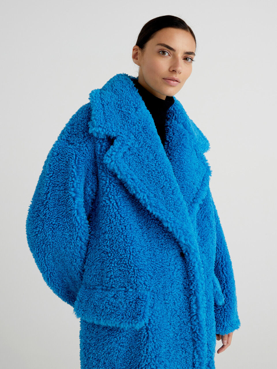 Long coat in synthetic fur