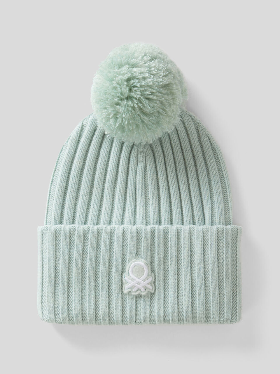 Hat with logo and pom pom image number 1