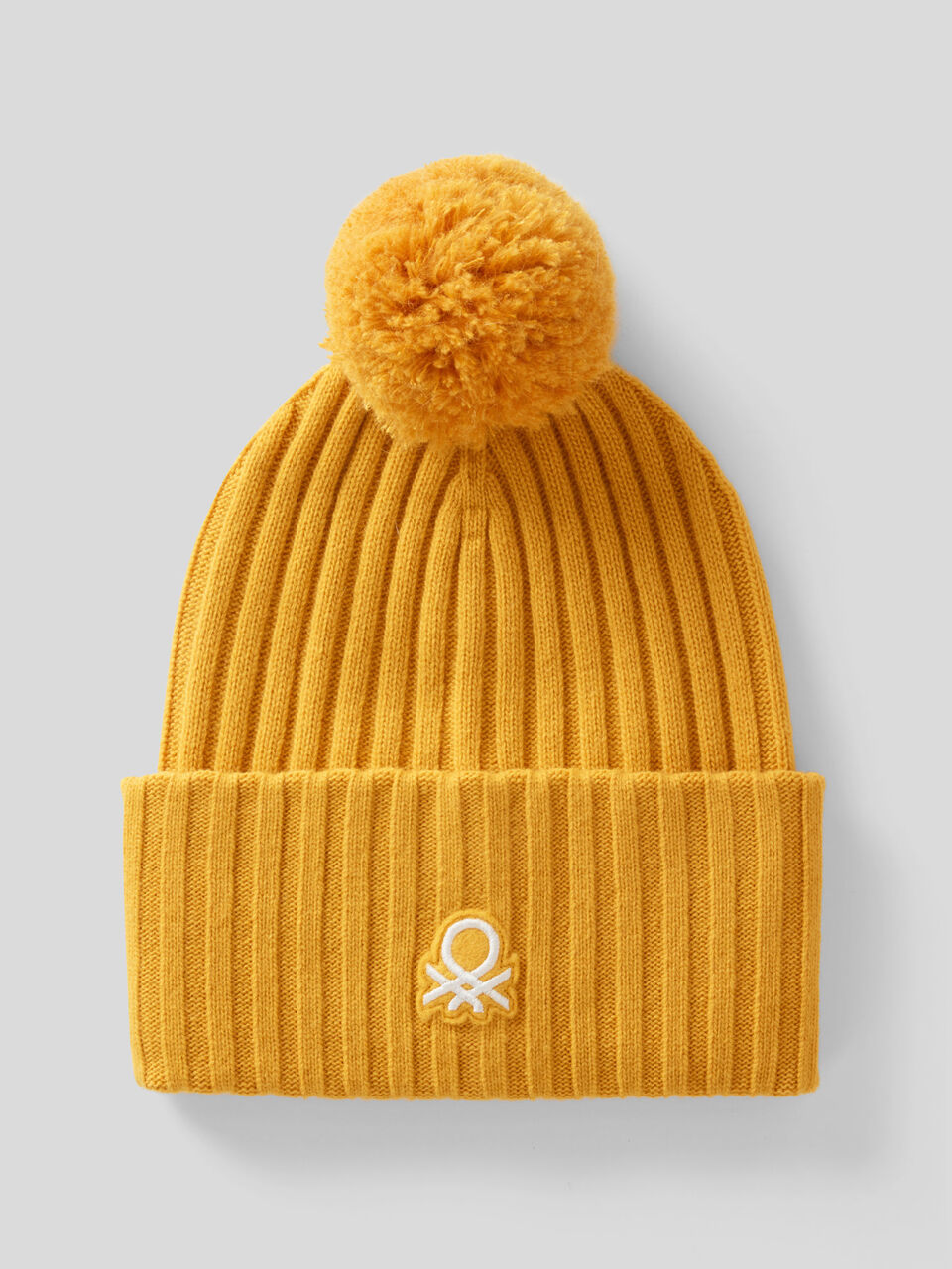 Hat with logo and pom pom image number 1