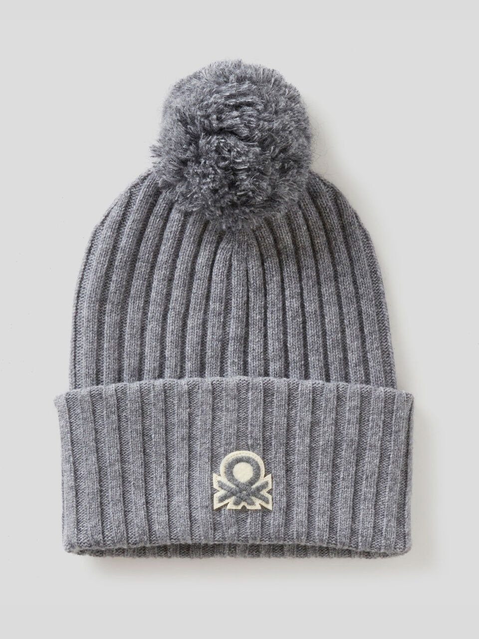 Hat with logo and pom pom image number 1