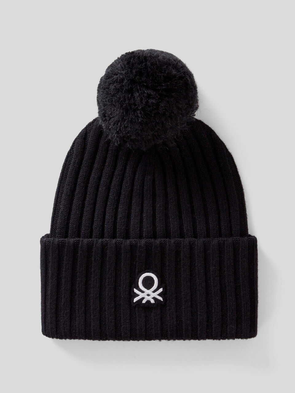 Hat with logo and pom pom image number 1