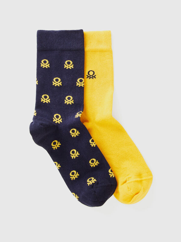 Two pairs of long socks with logos