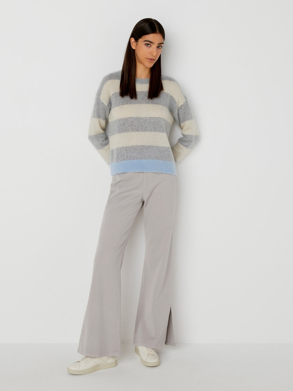 Flared trousers with slits